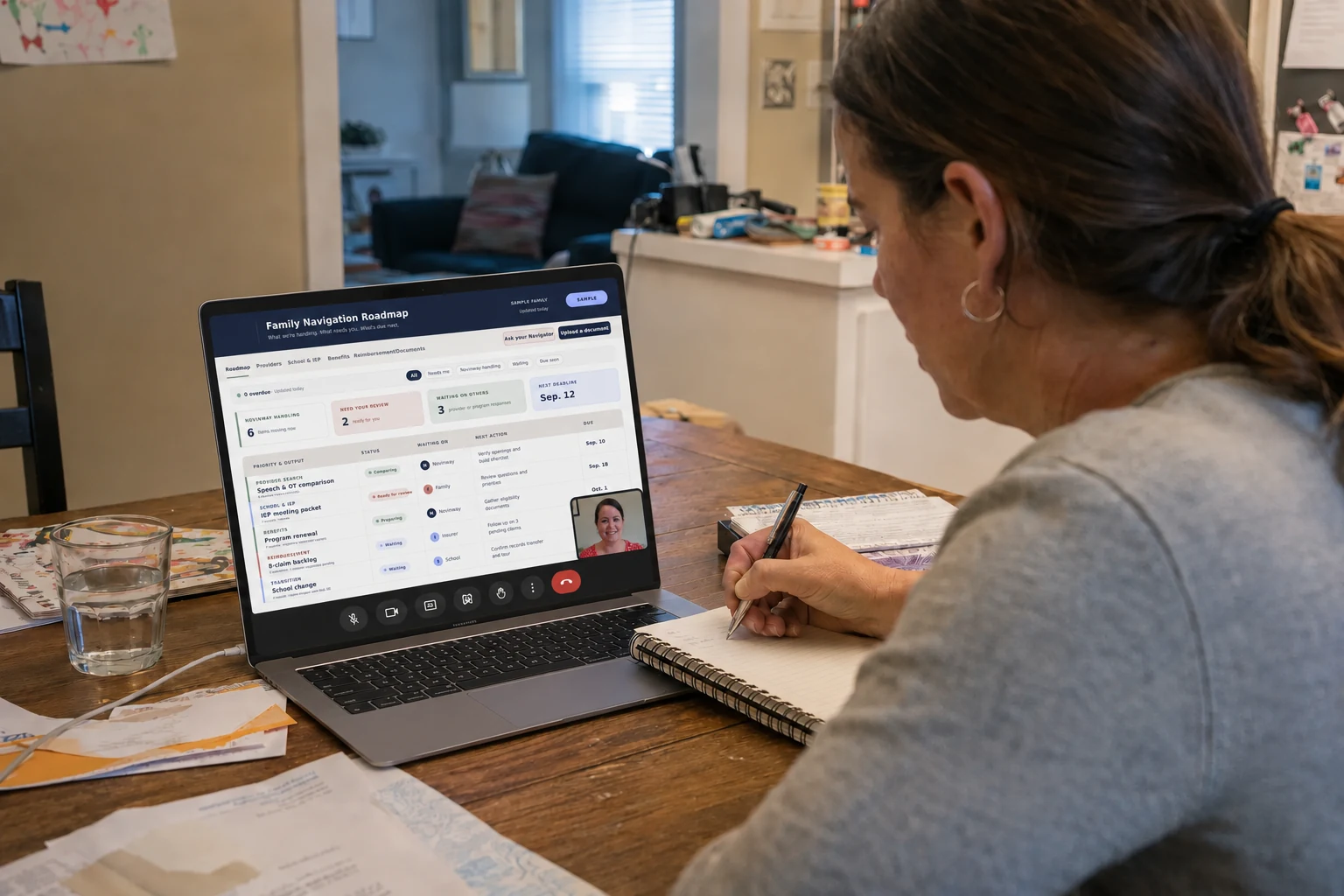 A parent taking notes while a Novinway Navigator shares a family roadmap during a video call