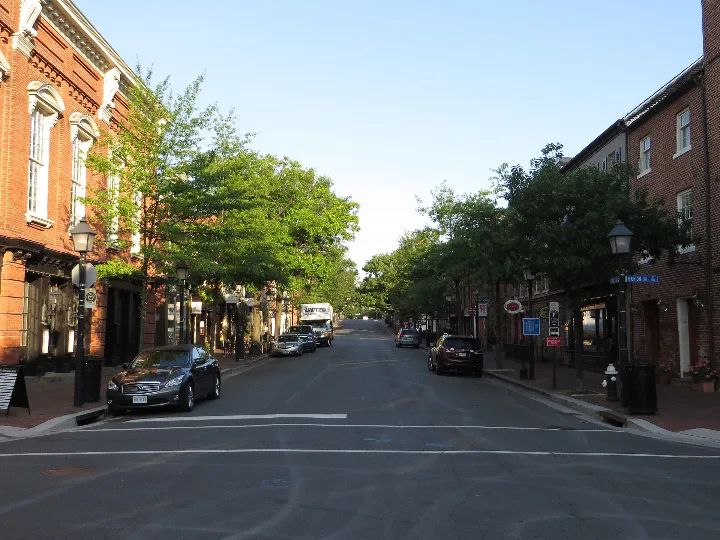 Brick storefronts and trees along King Street in Old Town Alexandria, Virginia